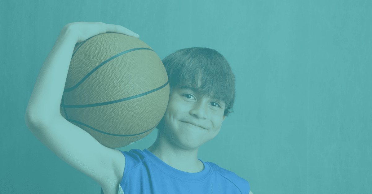 Young lad holding basketball